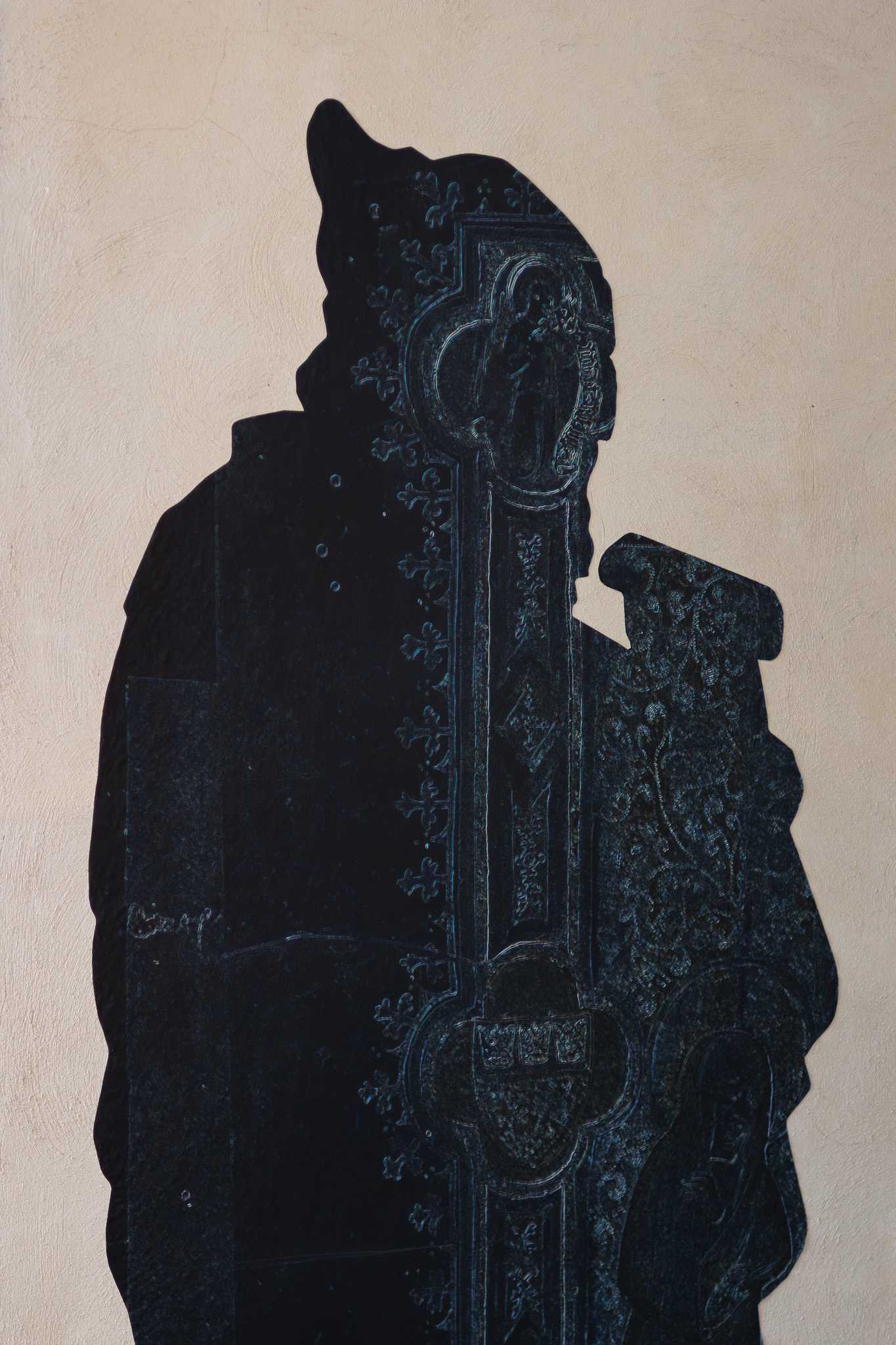 Close view of the prophet silhouette, its surface carrying ornament drawn from the illuminated opening page of Cologne's first oath book.